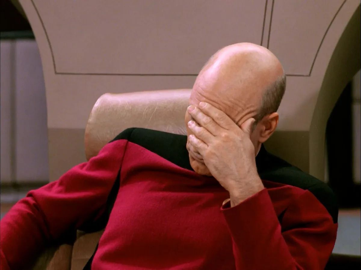 A meme of Captain Picard from Star Trek facepalming.
